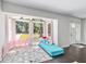 Inviting living room with large windows, offering abundant natural light and views of the outdoors at 3810 Sw 5Th Ave, Ocala, FL 34471