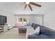 Bright living room with a large front window, plush seating, and an open layout for entertaining at 3810 Sw 5Th Ave, Ocala, FL 34471