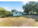Spacious backyard offers a serene retreat with mature trees providing shade and privacy at 3834 Se 9Th Pl, Ocala, FL 34471