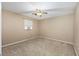 Bedroom with neutral carpet, ceiling fan, and a window air conditioning unit at 3834 Se 9Th Pl, Ocala, FL 34471