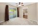 Inviting dining room with sliding doors and ceiling fan, adjoining the kitchen at 3834 Se 9Th Pl, Ocala, FL 34471