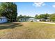 Charming one-story home features a well-manicured lawn, a wide driveway, and inviting curb appeal at 3834 Se 9Th Pl, Ocala, FL 34471