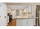 Efficient kitchen layout with granite counters and eat in bar, next to dining area at 3834 Se 9Th Pl, Ocala, FL 34471