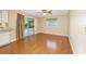 Bright living room featuring wood floors, sliding glass doors, and backyard views at 3834 Se 9Th Pl, Ocala, FL 34471
