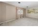 Inviting living room with plush carpet, soft window drapes, and an eye-catching landscape mural at 3834 Se 9Th Pl, Ocala, FL 34471
