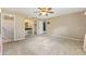 Large primary bedroom featuring ensuite bathroom, walk-in closet, and ceiling fan at 3834 Se 9Th Pl, Ocala, FL 34471