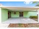 A covered patio offers a relaxing outdoor space, seamlessly connecting the indoors with the backyard at 3834 Se 9Th Pl, Ocala, FL 34471