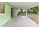 Covered patio is ideal for outdoor dining and relaxing, with views of the backyard at 3834 Se 9Th Pl, Ocala, FL 34471