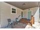 Cozy covered porch with outdoor seating, creating a relaxing and welcoming outdoor living space at 4180 W Anthony Rd, Ocala, FL 34475