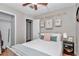 Cozy bedroom with soft bedding, decorative art, and hardwood floors for a relaxing ambiance at 4180 W Anthony Rd, Ocala, FL 34475