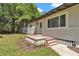 Front exterior of charming home with well-maintained lawn and tidy front garden at 4180 W Anthony Rd, Ocala, FL 34475