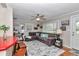 Comfortable living room featuring a comfortable couch, large window and wood floors at 4180 W Anthony Rd, Ocala, FL 34475