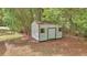 Shed with a secure door and functional window offers ample space for storage at 4180 W Anthony Rd, Ocala, FL 34475