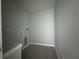 A compact laundry room with tile flooring and basic utility connections at 4424 Sw Carnation Ct, Dunnellon, FL 34431