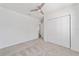 Light-filled bedroom featuring a ceiling fan and a spacious closet at 4778 Se 25Th Loop, Ocala, FL 34480