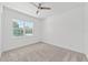 Bright bedroom with a large window offering a neighborhood view at 4778 Se 25Th Loop, Ocala, FL 34480