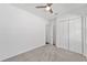Bedroom featuring a ceiling fan and a spacious closet at 4778 Se 25Th Loop, Ocala, FL 34480