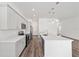 Stylish kitchen featuring white cabinetry, stainless steel appliances, and a large island with quartz countertops at 4778 Se 25Th Loop, Ocala, FL 34480