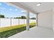 Covered patio with view of fenced backyard at 4778 Se 25Th Loop, Ocala, FL 34480