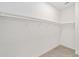 Bright walk-in closet with white shelving and tile floor at 4778 Se 25Th Loop, Ocala, FL 34480