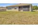 Backyard showing the house and screened-in patio at 5198 Ne 19Th Pl, Ocala, FL 34470
