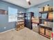 Bedroom with light blue walls, shelving, and window with blinds at 5198 Ne 19Th Pl, Ocala, FL 34470