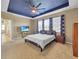Comfortable bedroom with plush carpet, a ceiling fan, and bright windows at 5198 Ne 19Th Pl, Ocala, FL 34470