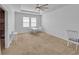 Open bonus room with plush carpet, bright windows, and versatile space at 5198 Ne 19Th Pl, Ocala, FL 34470