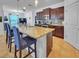 Kitchen featuring stainless appliances, custom cabinetry, and an island with seating at 5198 Ne 19Th Pl, Ocala, FL 34470