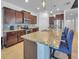 Kitchen featuring an island with seating, stainless appliances, and custom cabinetry at 5198 Ne 19Th Pl, Ocala, FL 34470