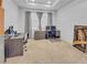 Office space with a ceiling tray, carpet flooring, and gray walls at 5198 Ne 19Th Pl, Ocala, FL 34470