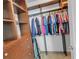 Organized walk-in closet with custom shelving and ample hanging space at 5198 Ne 19Th Pl, Ocala, FL 34470