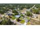 Aerial view of a residential neighborhood with homes, green trees, and lush lawns at 5220 Sw 161St Place Rd, Ocala, FL 34473