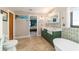 Charming bathroom featuring a farmhouse sink, soaking tub, and serene decor at 5220 Sw 161St Place Rd, Ocala, FL 34473
