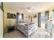 Comfortable bedroom featuring soft, yellow walls and plenty of natural light at 5220 Sw 161St Place Rd, Ocala, FL 34473