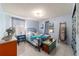 Relaxing bedroom featuring tiled floors, light blue walls and modern furnishings at 5220 Sw 161St Place Rd, Ocala, FL 34473