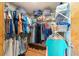 Organized walk-in closet with ample shelving and hanging space for clothing and accessories at 5220 Sw 161St Place Rd, Ocala, FL 34473