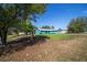 Single-story home with vibrant blue exterior, gray roof, and green lawn at 5220 Sw 161St Place Rd, Ocala, FL 34473