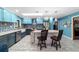 Well-lit kitchen with a spacious island, stainless steel appliances, and light-blue cabinetry at 5220 Sw 161St Place Rd, Ocala, FL 34473