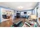 Spacious living room with hardwood floors, comfortable seating, and lots of natural light at 5220 Sw 161St Place Rd, Ocala, FL 34473