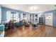 Bright living room with hardwood floors, comfortable seating, and a view of the outdoors at 5220 Sw 161St Place Rd, Ocala, FL 34473