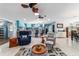 Open living area featuring bright kitchen, tile flooring and comfortable seating arrangement at 5220 Sw 161St Place Rd, Ocala, FL 34473