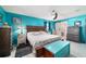 Bright main bedroom featuring tiled flooring, ceiling fan, and ensuite bathroom at 5220 Sw 161St Place Rd, Ocala, FL 34473