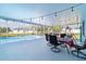 Charming screened patio with a swimming pool, outdoor seating, and string lights at 5220 Sw 161St Place Rd, Ocala, FL 34473