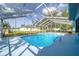 Clear, inviting pool with an extended screened-in lanai at 5220 Sw 161St Place Rd, Ocala, FL 34473