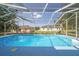 Refreshing pool inside screened enclosure, perfect for cooling off on sunny days at 5220 Sw 161St Place Rd, Ocala, FL 34473