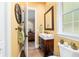 Stylish bathroom featuring a dark wood vanity, modern rectangular sink, and unique towel rack at 5484 Sw 30Th Ave, Ocala, FL 34471