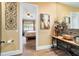 View from doorway into bathroom features a vessel sink, statement art, and decorative wrought iron at 5484 Sw 30Th Ave, Ocala, FL 34471