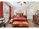 Charming bedroom features a patterned rug, hardwood floors, and a window for natural light at 5484 Sw 30Th Ave, Ocala, FL 34471