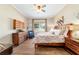 Spacious bedroom features a ceiling fan, hardwood floors, natural light, and neutral tones at 5484 Sw 30Th Ave, Ocala, FL 34471
